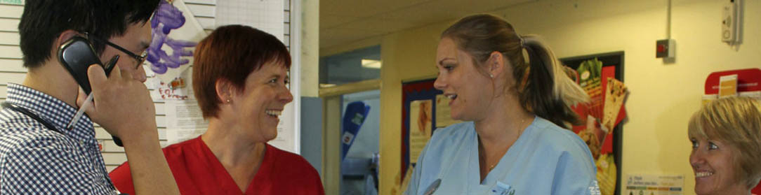 Clinical staff talking on a ward