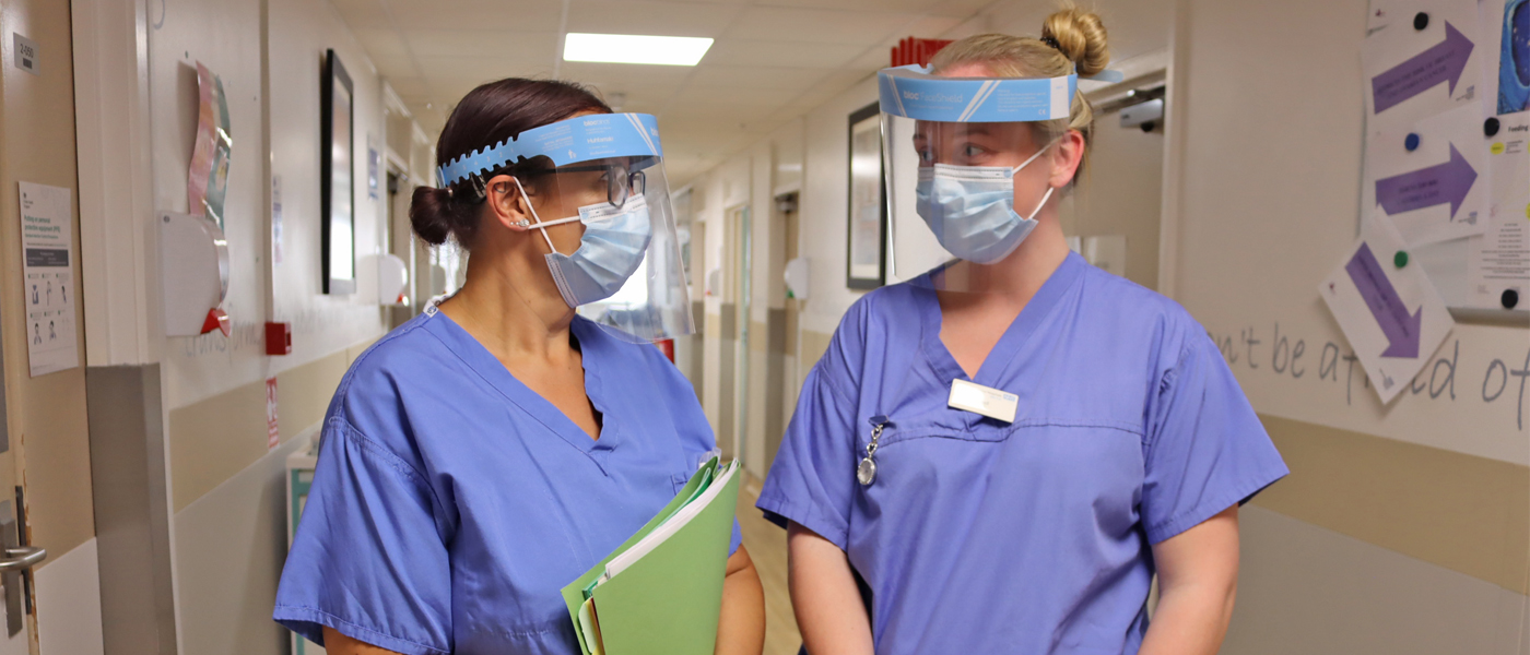 Picture of two maternity staff in PPE