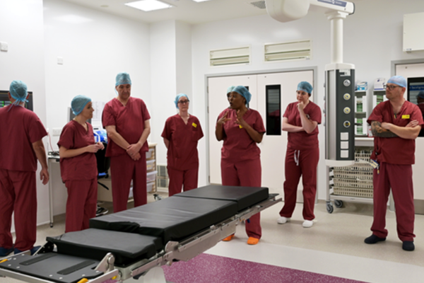 Daisy speaking with SACH theatre staff in one of the new theatres.png