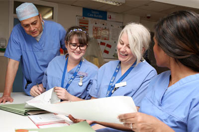 Picture of four hospital staff in a ward