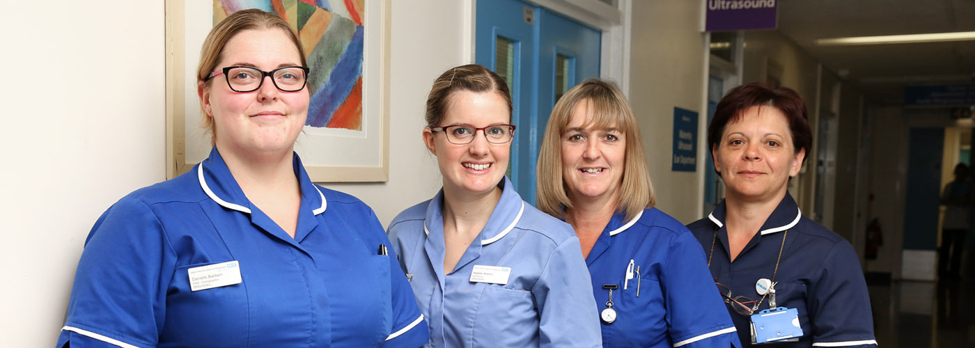 Maternity staff standing in a corridor