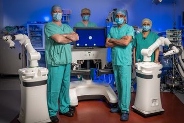 Picture of staff with surgical robot