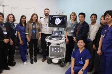 echocardiology team with echo machine