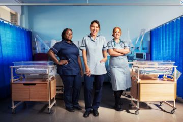 Emma Willis with two members of staff on a hospital ward
