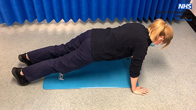Picture of a person preforming a press up