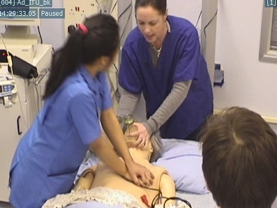 Picture of staff simulating resuscitation on a mannequin