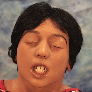 picture showing a realistic paediatric manikin, roughly 9 to 10 years of age